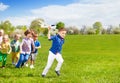 Kids running and boy holding white airplane toy Royalty Free Stock Photo