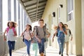 Kids running in elementary school corridor, close up Royalty Free Stock Photo