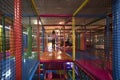 Kids running inside a Colorful indoor playground