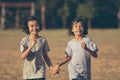 Kids running and playing on field Royalty Free Stock Photo