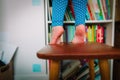 Kids safety- little girl climb on chair at home