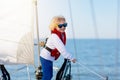 Kids sail on yacht in sea. Child sailing on boat Royalty Free Stock Photo