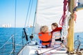 Kids sail on yacht in sea. Child sailing on boat. Royalty Free Stock Photo