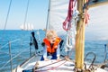 Kids sail on yacht in sea. Child sailing on boat. Royalty Free Stock Photo