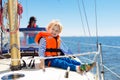 Kids sail on yacht in sea. Child sailing on boat Royalty Free Stock Photo