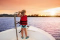 Kids sail on yacht in sea. Child sailing on boat. Royalty Free Stock Photo