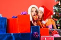 Kids in Santa hats with gift boxes, copy space. Royalty Free Stock Photo