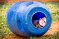 Santa Maria de Fe, Misiones, Paraguay - Boy Child Playing inside Blue Plastic Barrel in Santa Maria