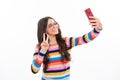 Kids selfie. Teenager child girl holding smartphone. Hipster girl with cell phone. Kid hold mobile phone texting in Royalty Free Stock Photo