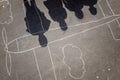 Kids shadows over a chalk plane