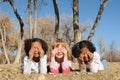 Kids shielding sun from eyes