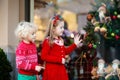Kids shopping for Christmas presents. Children buy Xmas decorati Royalty Free Stock Photo