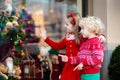 Kids shopping for Christmas presents. Children buy Xmas decorati Royalty Free Stock Photo