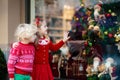 Kids shopping for Christmas presents. Children buy Xmas decorati Royalty Free Stock Photo