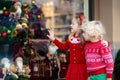 Kids shopping for Christmas presents. Children buy Xmas decoration