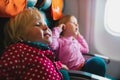 Kids shout in plane, family in flight, small sisters tired of flying