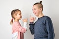 Kids show friendship and forgiveness, white background