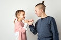 Kids show friendship and forgiveness, white background