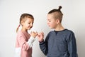 Kids show friendship and forgiveness, white background