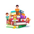 Kids sitting and reading on a huge pile of books Royalty Free Stock Photo