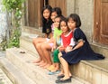 Kids sitting on stairs in Yogyakarta