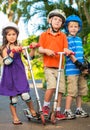 Kids with Skate Boards and Scooters Royalty Free Stock Photo