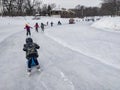 Kids skating at Lafontaine Park natural ice rink