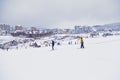 Kids skiing down the hill