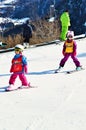 Kids skiing in Swiss Alps