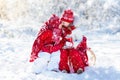 Kids sledding in winter forest. Children drink hot cocoa in snow Royalty Free Stock Photo