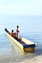 Kids in small boat in Arborek