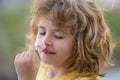 Kids smelling summer flower, closeup face. Funny child face close up. Kids head portrait. Close up faces kid. Funny kids Royalty Free Stock Photo