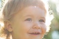 Kids smiling, cute smile. Funny child cropped face close up. Baby head portrait outdoor. Royalty Free Stock Photo