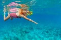 Kids in snorkeling mask dive underwater in blue sea lagoon Royalty Free Stock Photo