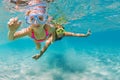 Kids in snorkeling mask dive underwater in blue sea lagoon Royalty Free Stock Photo