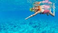 Kids in snorkeling mask dive underwater in blue sea lagoon Royalty Free Stock Photo