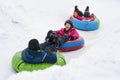 Kids Winter Snowtubing Royalty Free Stock Photo