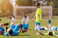 Kids soccer football - children players celebrating after victo Royalty Free Stock Photo