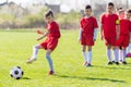 Kids soccer football - children players exercising before match