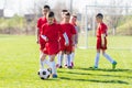 Kids soccer football - children players exercising before match