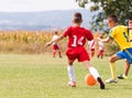 Kids soccer football - children players match on soccer field