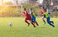 Kids soccer football - children players match on soccer field Royalty Free Stock Photo