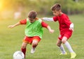 Kids soccer football - children players match on soccer field Royalty Free Stock Photo