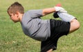Kids soccer football - little goalkeeper is stretching before so
