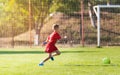 Kids soccer football - children players match on soccer field Royalty Free Stock Photo