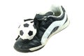 Kids soccer footwear and ball Royalty Free Stock Photo