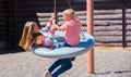 Kids Spin on Playground Swing