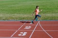 Kids sport, child running on stadium track, training and fitness