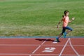 Kids sport, child running on stadium track, training and fitness Royalty Free Stock Photo