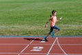 Kids sport, child running on stadium track, training and fitness Royalty Free Stock Photo